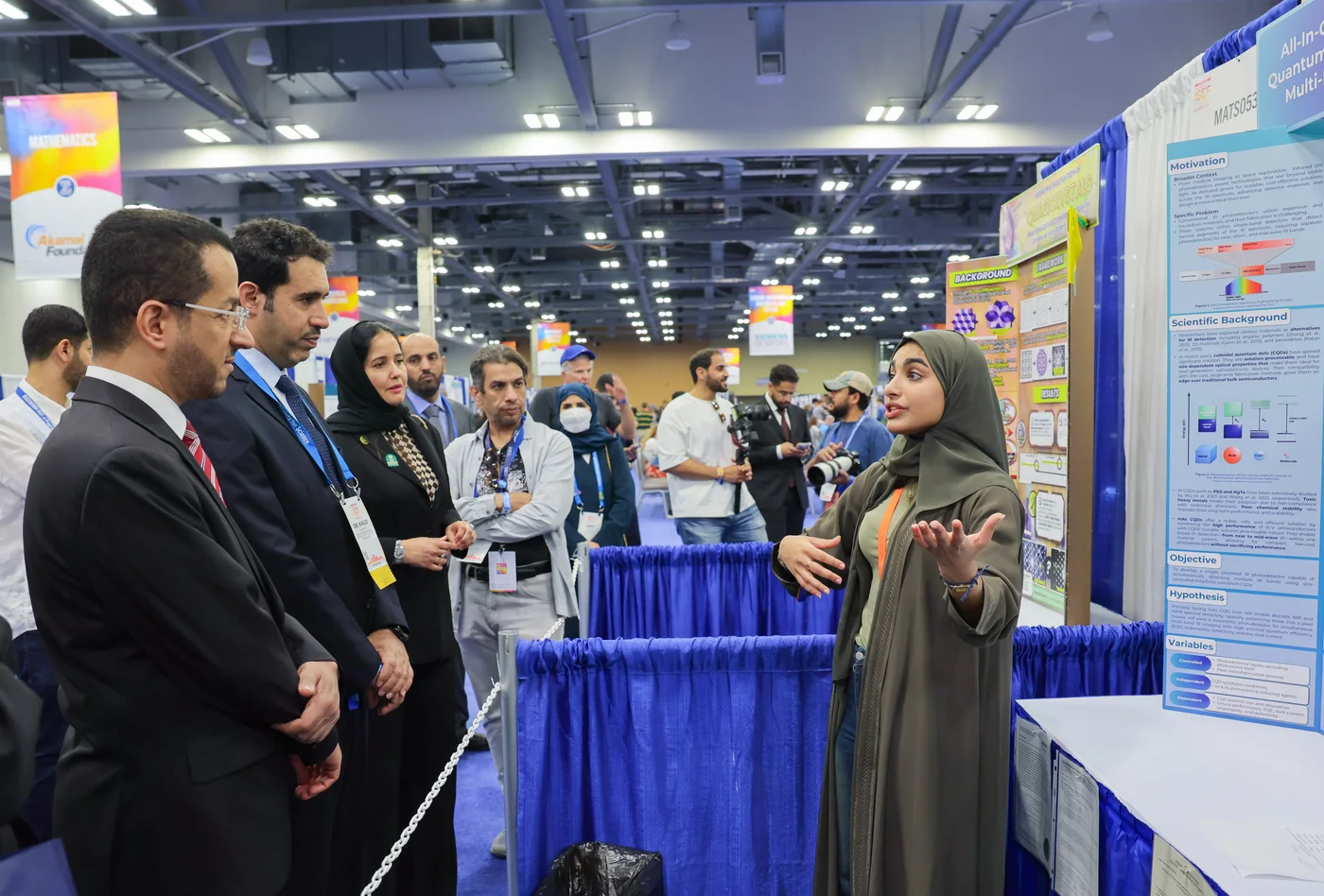 Abeer Alyousef presenting a research project at a science fair